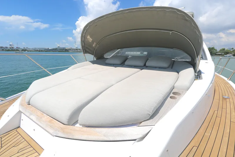 Slide: The Image of Luxurious 2020 Azimut 55 yacht with spacious sunbed and canopy on deck. - 26