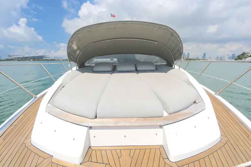 Slide: The Image of Luxurious 2020 Azimut 55 yacht with spacious sunbed on deck, overlooking serene waters. - 27