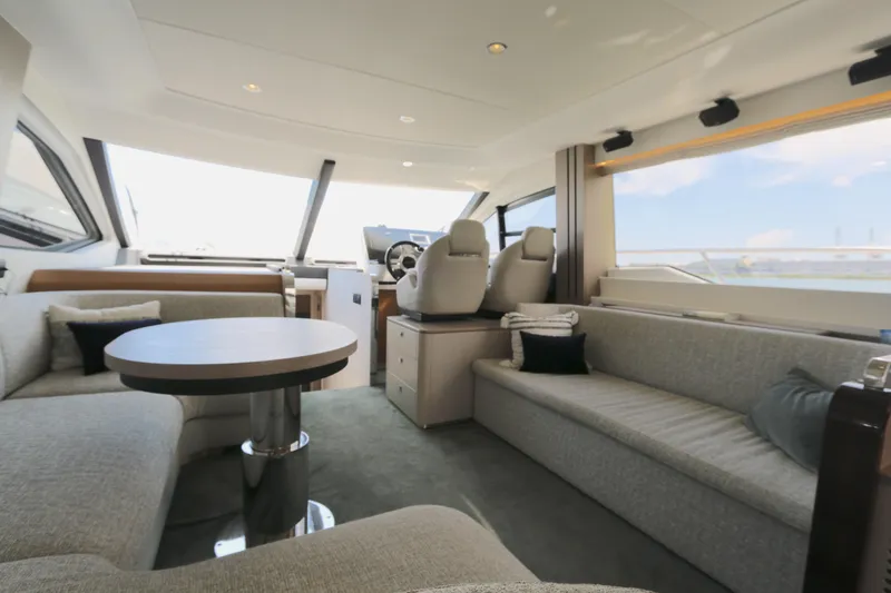 Slide: The Image of Luxurious interior of a 2020 Azimut 55 yacht with plush seating and modern design. - 4