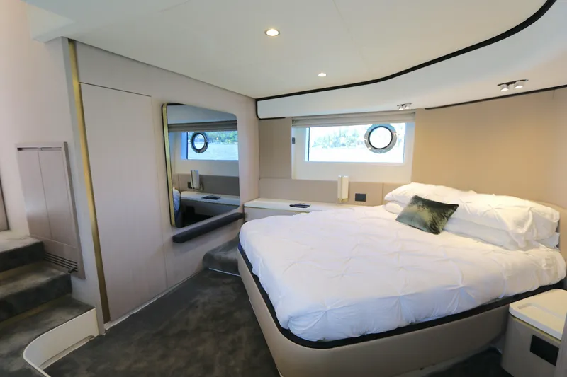 Slide: The Image of Luxurious bedroom interior of 2020 Azimut 55 yacht with modern design and cozy bedding. - 8