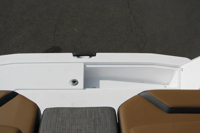 Slide: The Image of 2022 Scarab 215 ID boat interior with brown seating and white deck. - 18