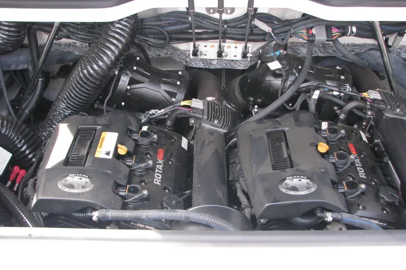Slide: The Image of Engine compartment of 2022 Scarab 215 ID boat featuring dual Rotax engines. - 20