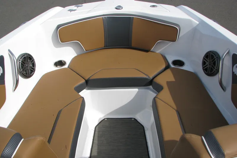 Slide: The Image of Interior seating of 2022 Scarab 215 ID boat with brown and black upholstery. - 6