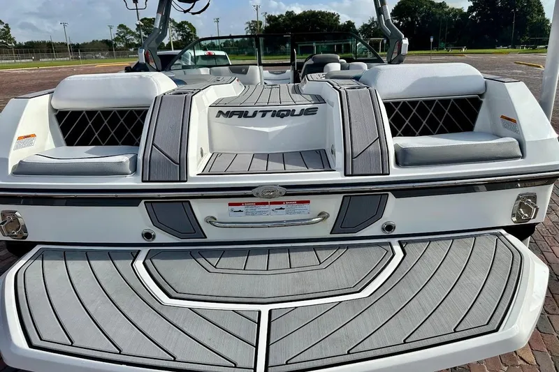 Slide: The Image of 2018 Nautique Super Air Nautique GS22 boat, rear view with seating and deck details. - 15