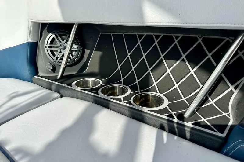 Slide: The Image of 2018 Nautique Super Air Nautique GS22 interior with speaker and cup holders. - 29