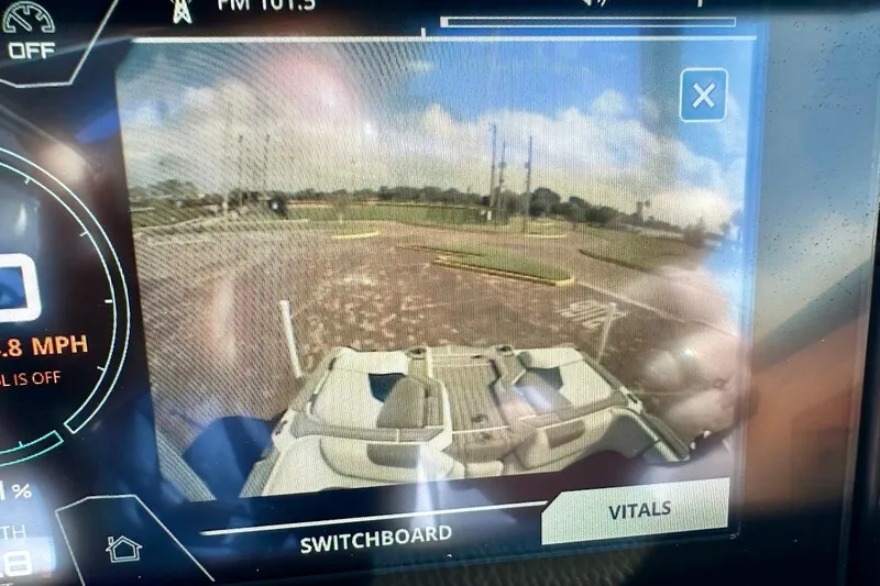 Slide: The Image of Dashboard display of a 2018 Nautique Super Air Nautique GS22, showing rearview camera and controls. - 46