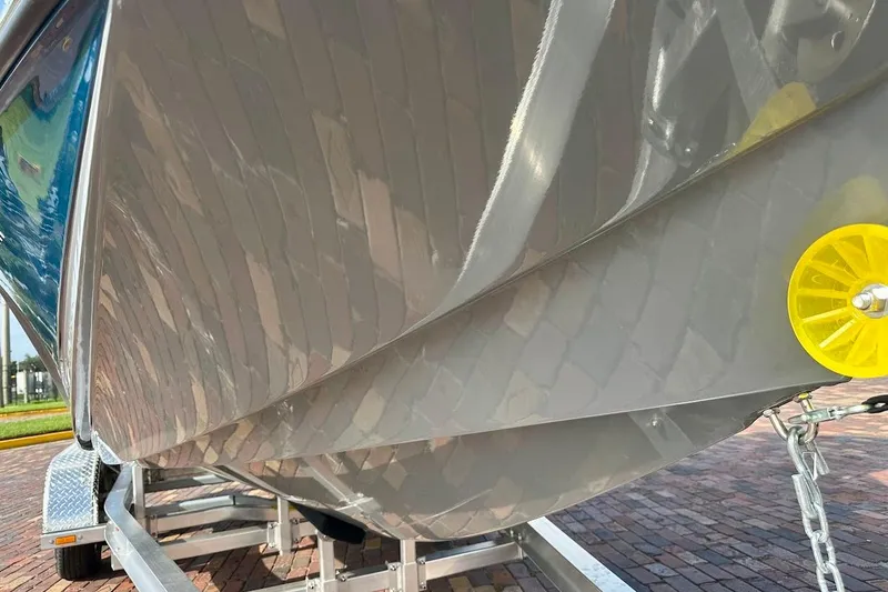 Slide: The Image of 2018 Nautique Super Air Nautique GS22 boat hull on trailer, close-up view. - 7