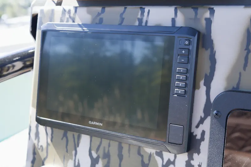 Slide: The Image of Garmin display on 2026 Avid 22 Recon boat with camouflage pattern. - 12