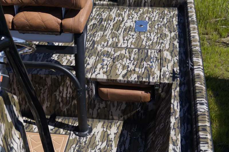 Slide: The Image of 2026 Avid 22 Recon boat interior with camouflage design and brown seating. - 15