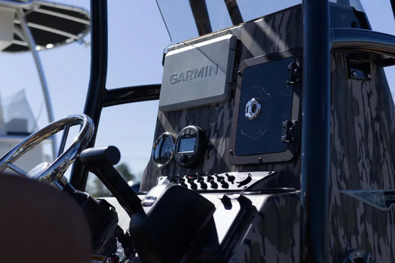 Slide: The Image of Control panel of 2026 Avid 22 Recon boat featuring Garmin navigation system. - 6