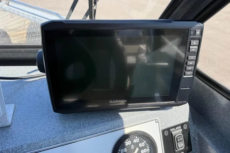 Slide: The Image of Garmin display on 2021 KingFisher 1625 Falcon boat dashboard, featuring control buttons. - 15