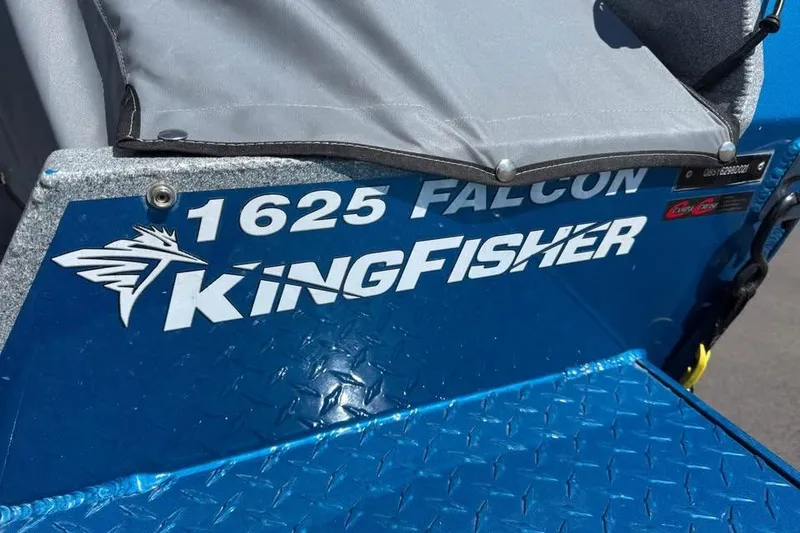 Slide: The Image of Close-up of 2021 KingFisher 1625 Falcon boat logo on blue metal surface. - 17