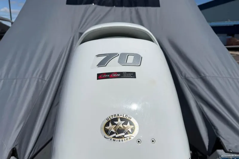 Slide: The Image of Outboard motor on a 2021 KingFisher 1625 Falcon boat, featuring ultra-low emissions. - 19