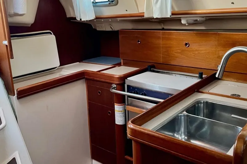 Slide: The Image of Interior view of 1999 Beneteau Oceanis 321 yacht kitchen with sink and stove. - 10
