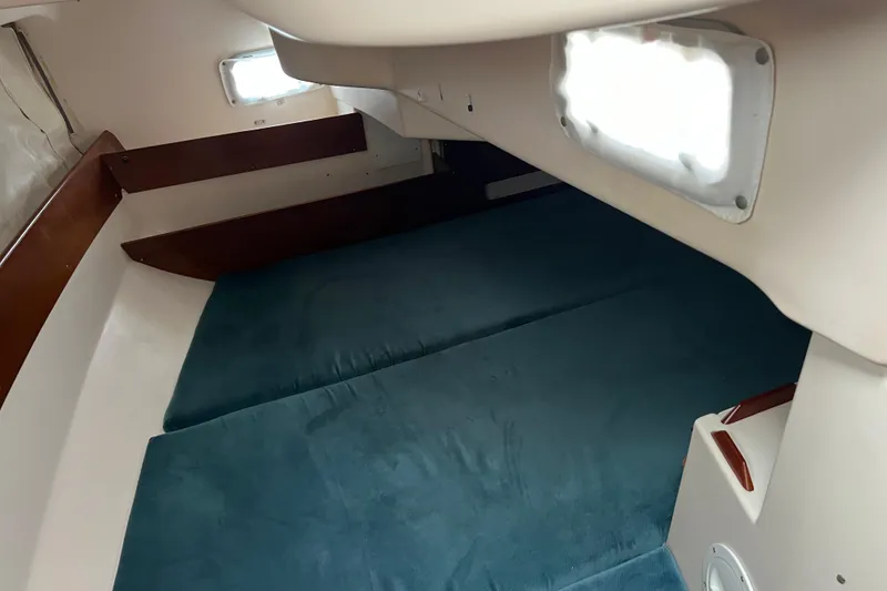 Slide: The Image of Interior cabin of a 1999 Beneteau Oceanis 321 sailboat with blue cushions. - 20
