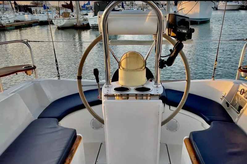 Slide: The Image of Cockpit of 1999 Beneteau Oceanis 321 sailboat with steering wheel and seating. - 3