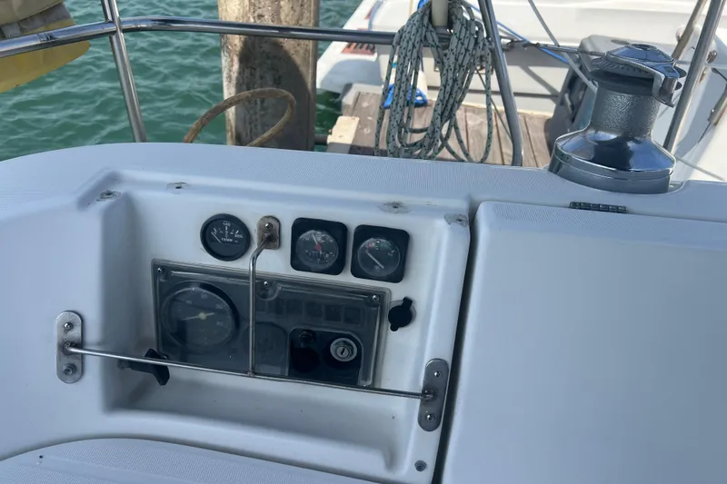 Slide: The Image of Control panel of a 1999 Beneteau Oceanis 321 sailboat docked at a marina. - 32