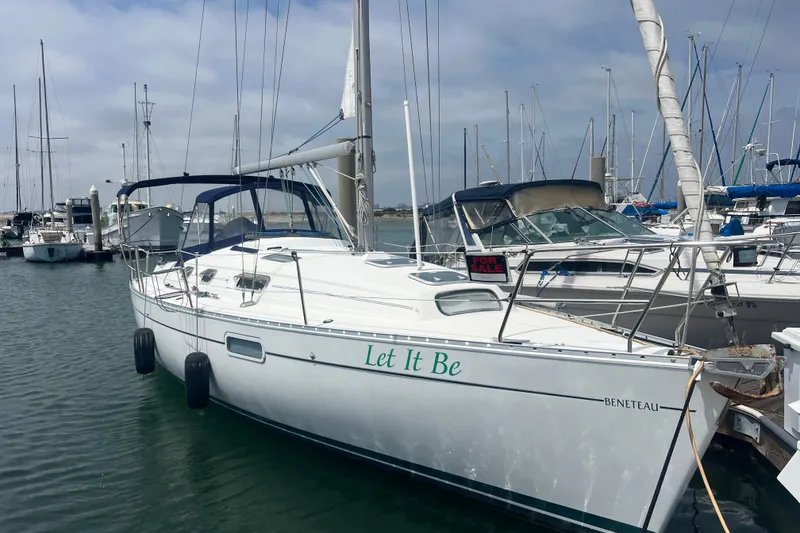Slide: The Image of 1999 Beneteau Oceanis 321 sailboat named "Let It Be" docked, with a "For Sale" sign. - 43