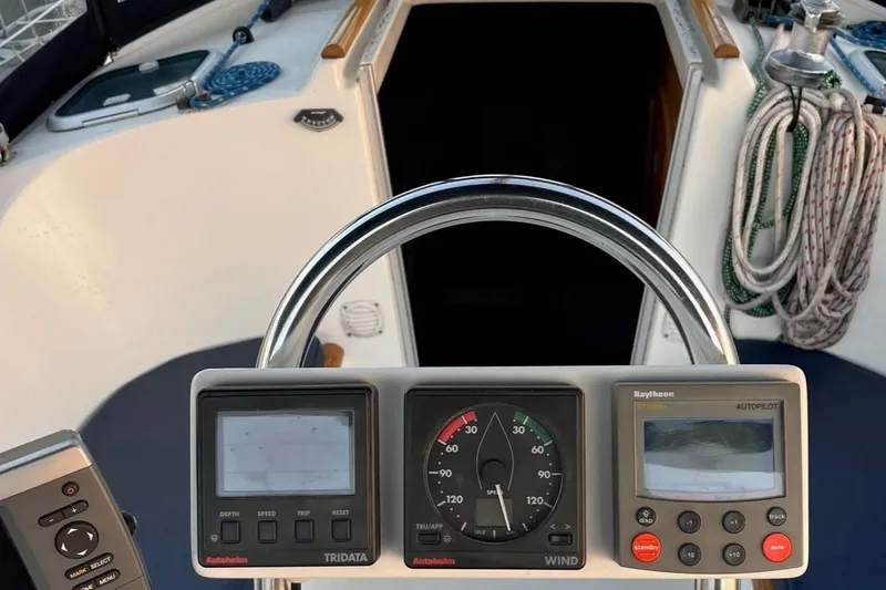 Slide: The Image of Cockpit view of 1999 Beneteau Oceanis 321 sailboat with navigation instruments. - 6