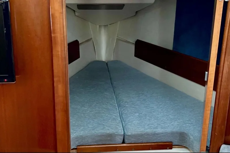 Slide: The Image of Interior cabin of a 1999 Beneteau Oceanis 321 sailboat with twin berths. - 9
