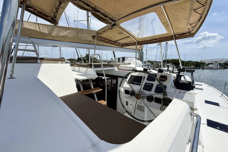 Slide: The Image of 2018 Fountaine Pajot Saona 47 yacht cockpit with steering wheel and navigation instruments. - 14