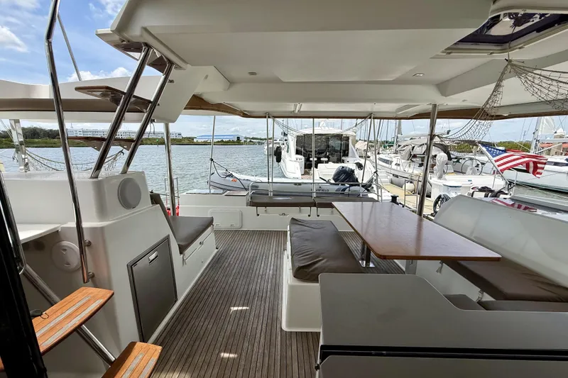 Slide: The Image of Spacious deck of 2018 Fountaine Pajot Saona 47 catamaran, featuring seating and dining area. - 18