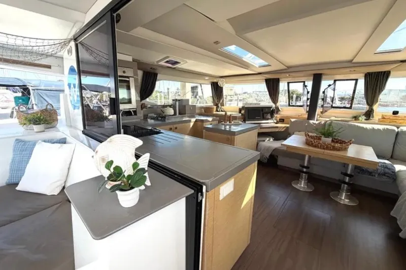 Slide: The Image of Luxurious interior of 2018 Fountaine Pajot Saona 47 catamaran with modern furnishings and ample natural light. - 20