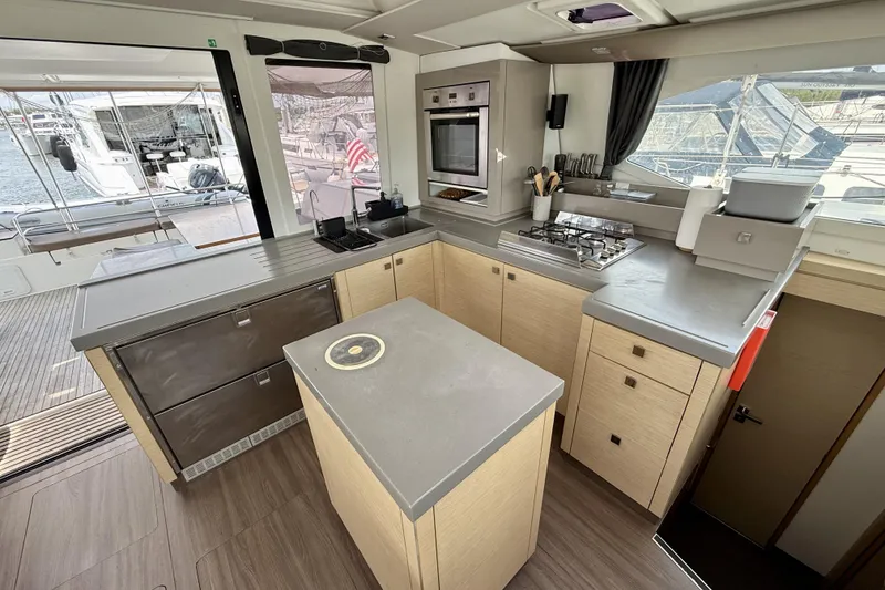 Slide: The Image of Modern kitchen interior of 2018 Fountaine Pajot Saona 47 catamaran with sleek countertops and appliances. - 26