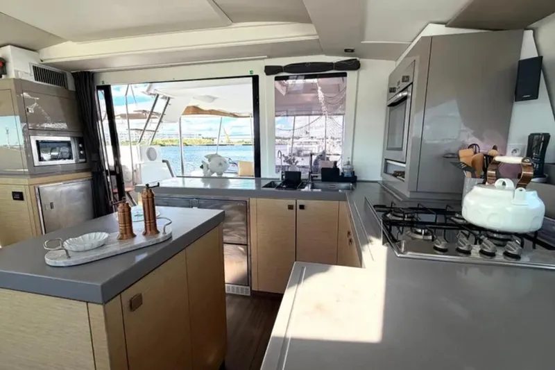 Slide: The Image of Modern kitchen interior of 2018 Fountaine Pajot Saona 47 catamaran with ocean view. - 27