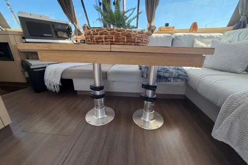 Slide: The Image of Interior of 2018 Fountaine Pajot Saona 47 catamaran with modern seating and table. - 29