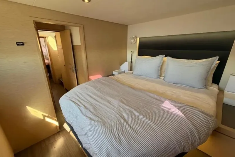 Slide: The Image of Luxurious bedroom interior of 2018 Fountaine Pajot Saona 47 catamaran, featuring a cozy bed. - 35