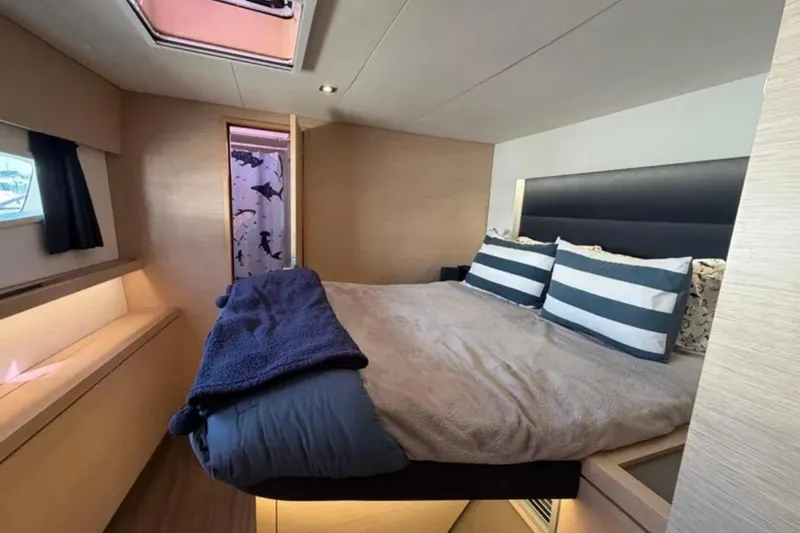 Slide: The Image of Luxurious cabin interior of 2018 Fountaine Pajot Saona 47 catamaran with cozy bedding. - 40