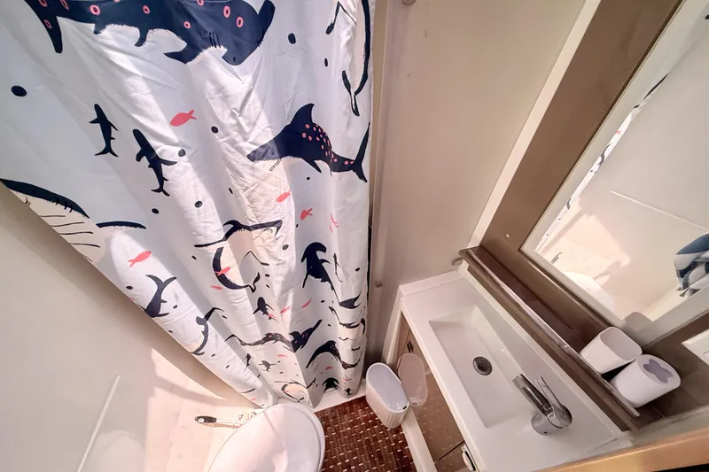 Slide: The Image of Bathroom interior of 2018 Fountaine Pajot Saona 47 with marine-themed shower curtain. - 41