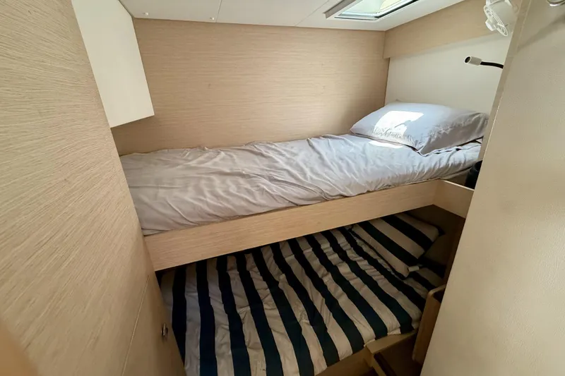 Slide: The Image of Bunk beds in 2018 Fountaine Pajot Saona 47 catamaran cabin, featuring modern design. - 43