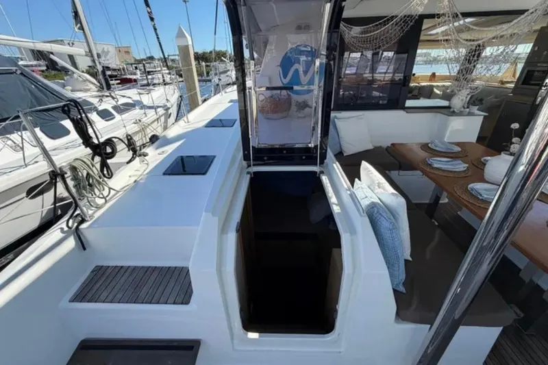 Slide: The Image of 2018 Fountaine Pajot Saona 47 yacht interior with dining area and open deck view. - 45