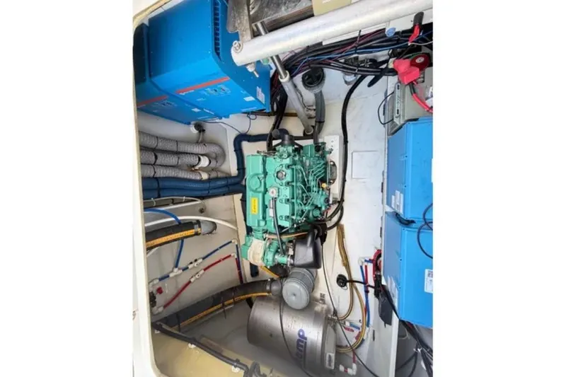 Slide: The Image of Engine room of 2018 Fountaine Pajot Saona 47 catamaran, showcasing mechanical components and wiring. - 52