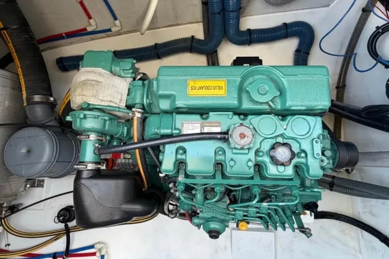 Slide: The Image of Engine compartment of a 2018 Fountaine Pajot Saona 47 catamaran, featuring a Volvo Penta engine. - 55