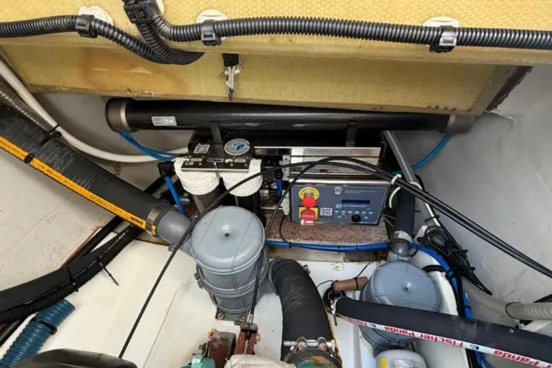 Slide: The Image of Engine room of 2018 Fountaine Pajot Saona 47 catamaran with mechanical components and wiring. - 57