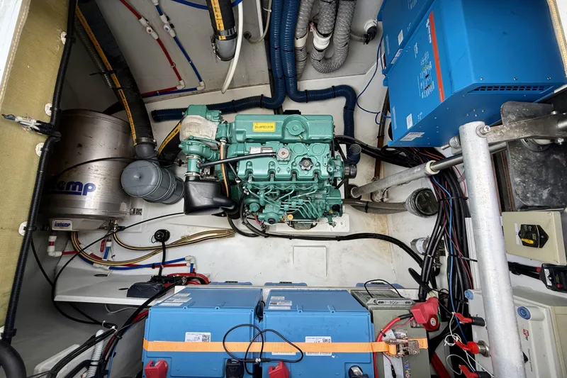 Slide: The Image of Engine room of a 2018 Fountaine Pajot Saona 47 catamaran, showcasing machinery and wiring. - 62