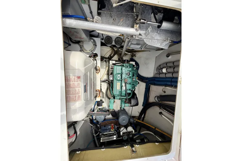 Slide: The Image of Engine compartment of 2018 Fountaine Pajot Saona 47 catamaran, showcasing mechanical components and wiring. - 63
