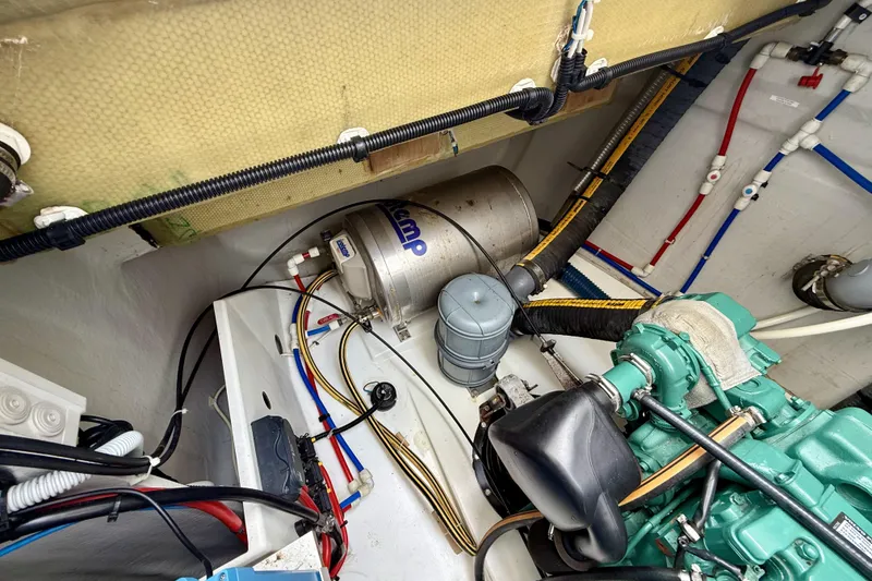 Slide: The Image of Engine room of 2018 Fountaine Pajot Saona 47 catamaran, showcasing mechanical components and wiring. - 66