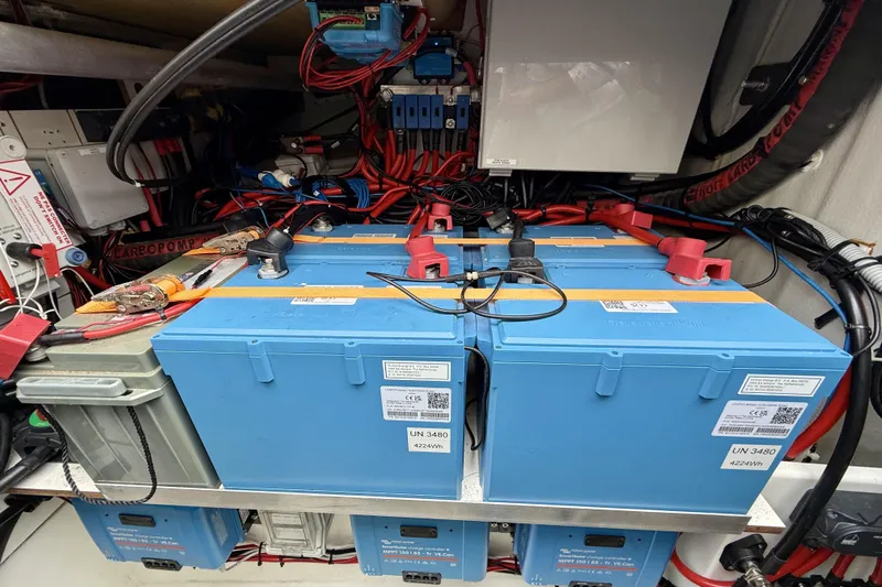 Slide: The Image of Electrical system of a 2018 Fountaine Pajot Saona 47 catamaran, featuring blue lithium batteries. - 68