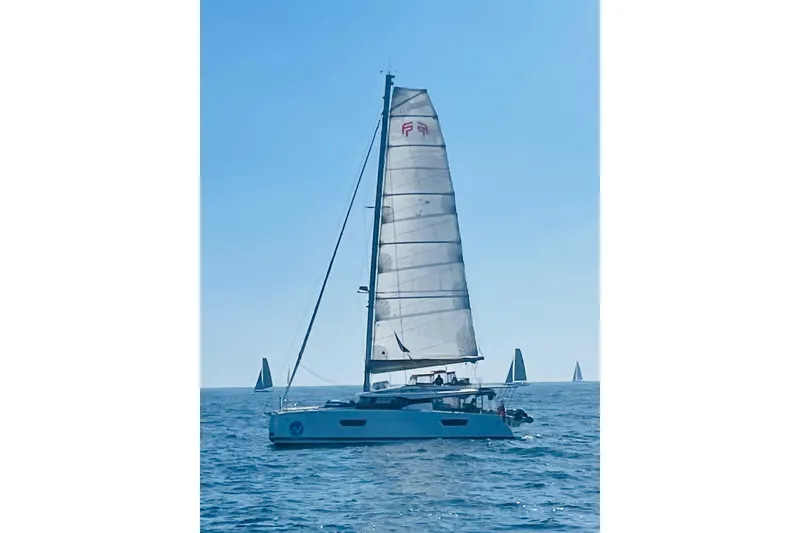 Slide: The Image of 2018 Fountaine Pajot Saona 47 sailing on open sea under clear blue sky. - 7