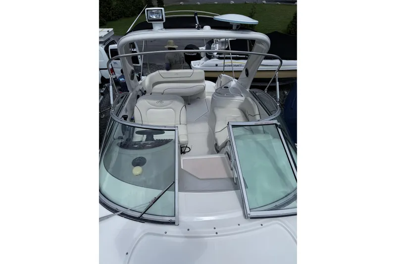 Slide: The Image of 2007 Monterey 270 Cruiser boat interior with open windshield and seating area. - 4