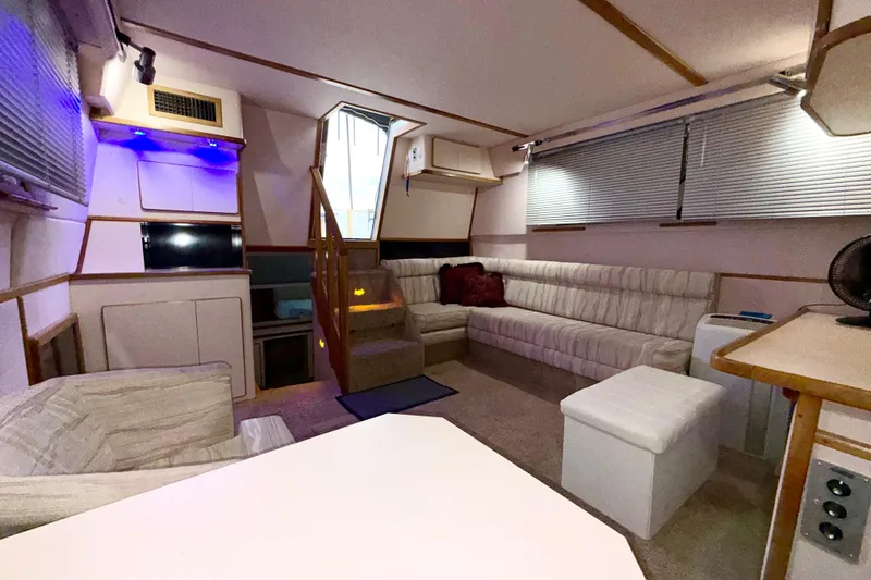Slide: The Image of Interior of 1989 Sea Ray 380 Aft Cabin yacht with cozy seating and modern amenities. - 19