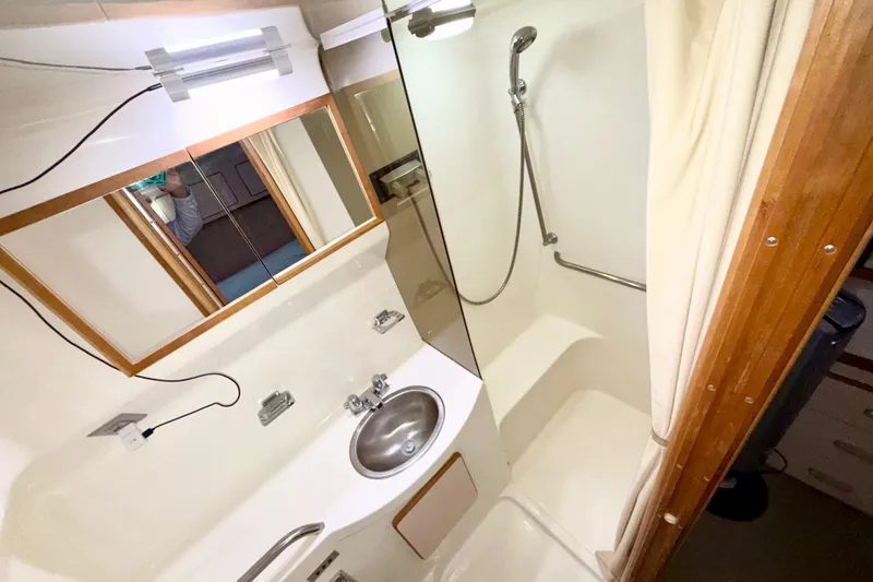 Slide: The Image of Bathroom interior of 1989 Sea Ray 380 Aft Cabin yacht with shower and sink. - 24