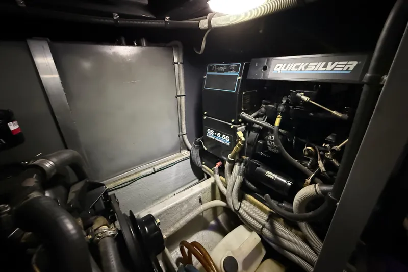 Slide: The Image of Engine room of 1989 Sea Ray 380 Aft Cabin with Quicksilver marine generator. - 31