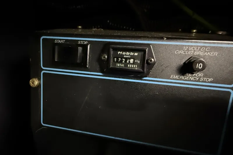 Slide: The Image of Control panel of a 1989 Sea Ray 380 Aft Cabin with hour meter and circuit breaker. - 36