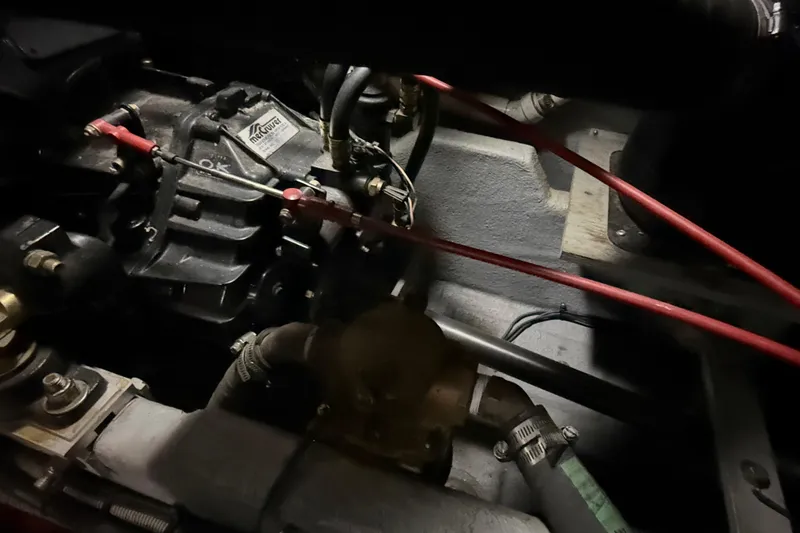 Slide: The Image of Engine compartment of a 1989 Sea Ray 380 Aft Cabin with visible hoses and fittings. - 38