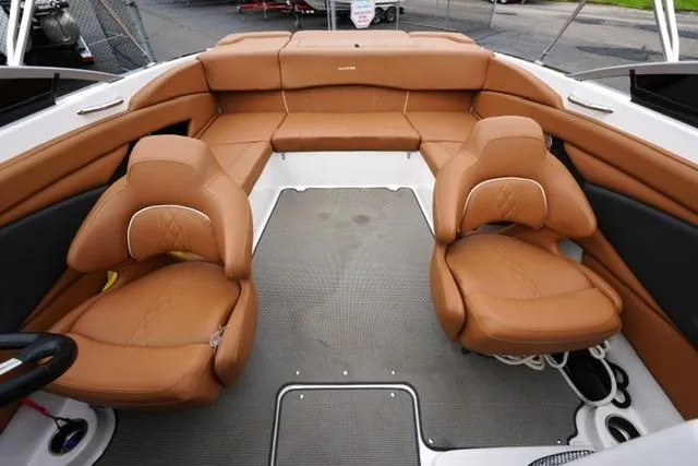 Slide: The Image of 2017 Glastron GT 245 boat interior with tan leather seating and modern design. - 11